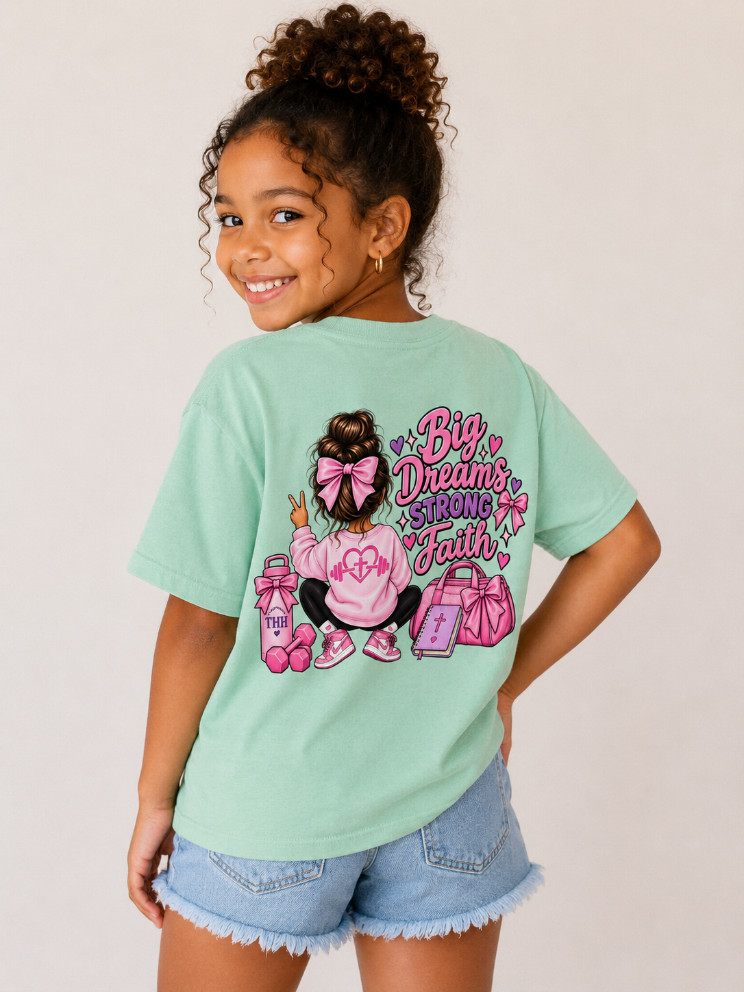 Youth Tee — "Big Dreams, Bigger Faith" Pink Bow Graphic